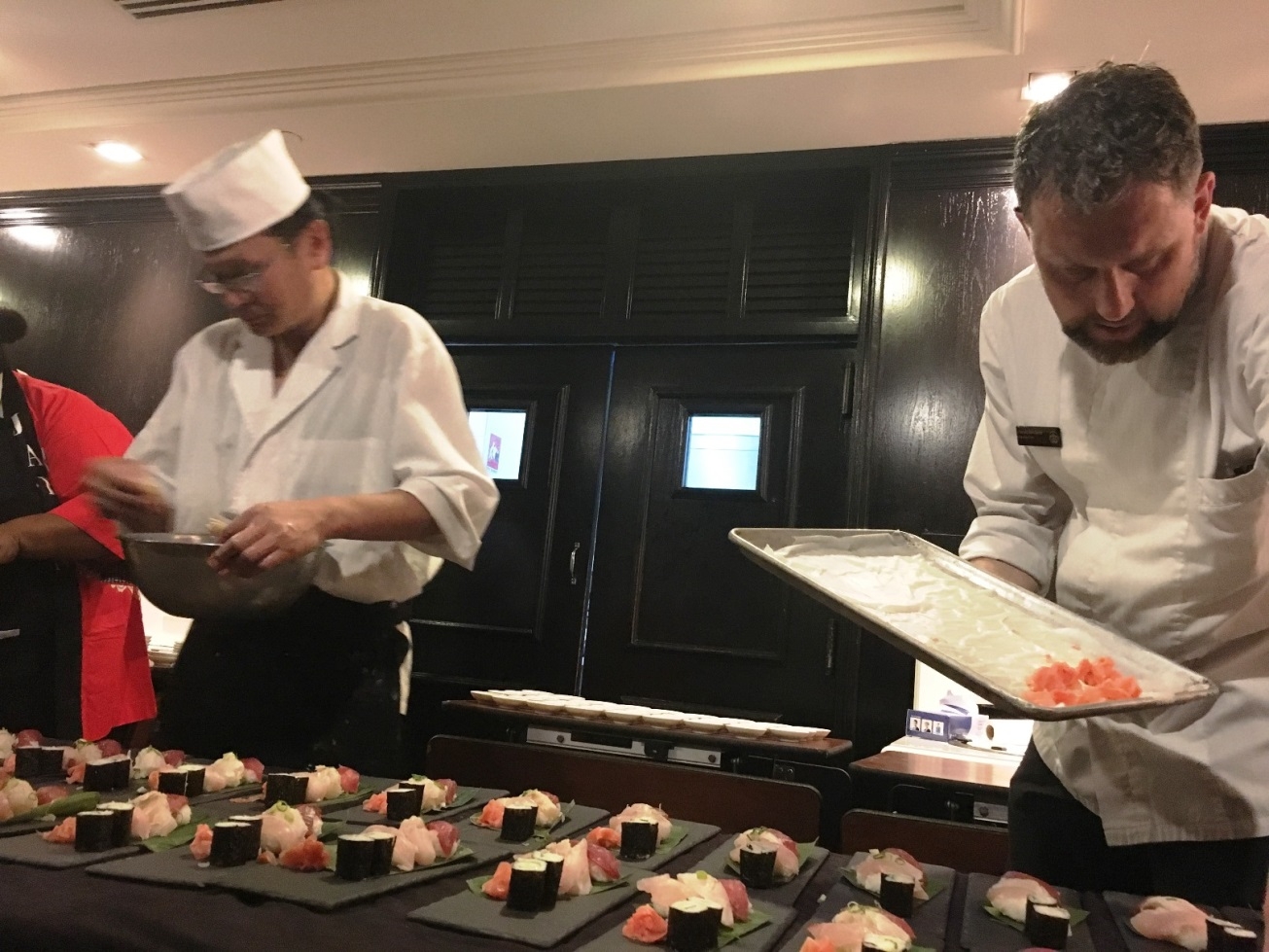 The Japanese chef for Ambassador preparing sushi with a hotel chef