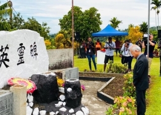 Offering a wreath and a moment of silence